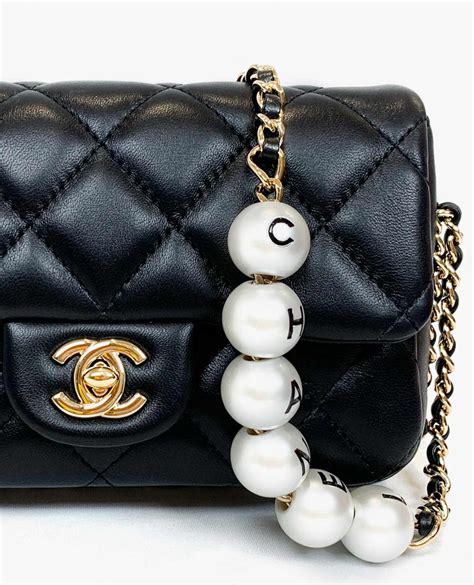 chanel pearl bag black|chanel bag with pearls strap.